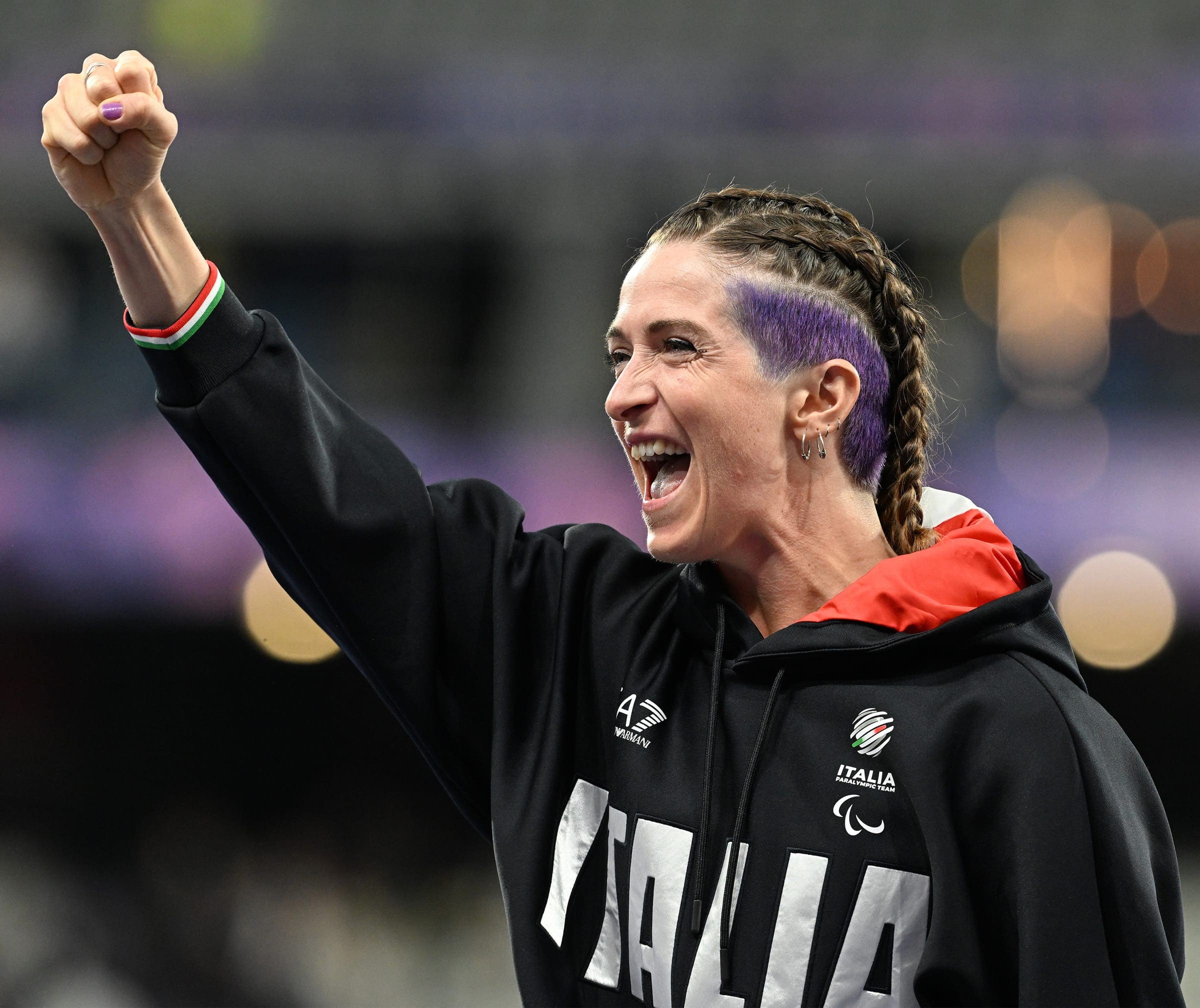 Martina Caironi celebrates with a raised fist after the 100 metres final at Paris 2024